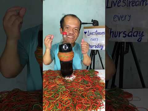 Thumbnail for 🔴 More than 1000 Rubber Bands tied around a Coca Cola bottle - What happens when You Push Too Far ?